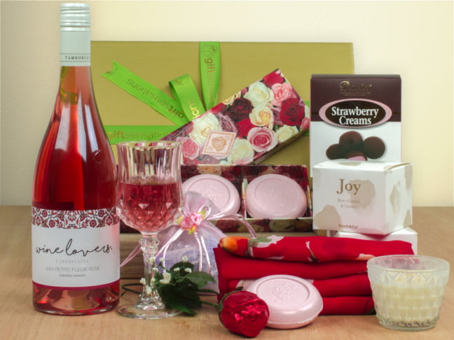 Gift basket showing Rose wine, scarf and soaps and chocolates.